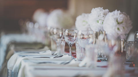 Table with flowers and glasses